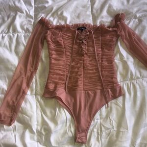 Light pink body suit